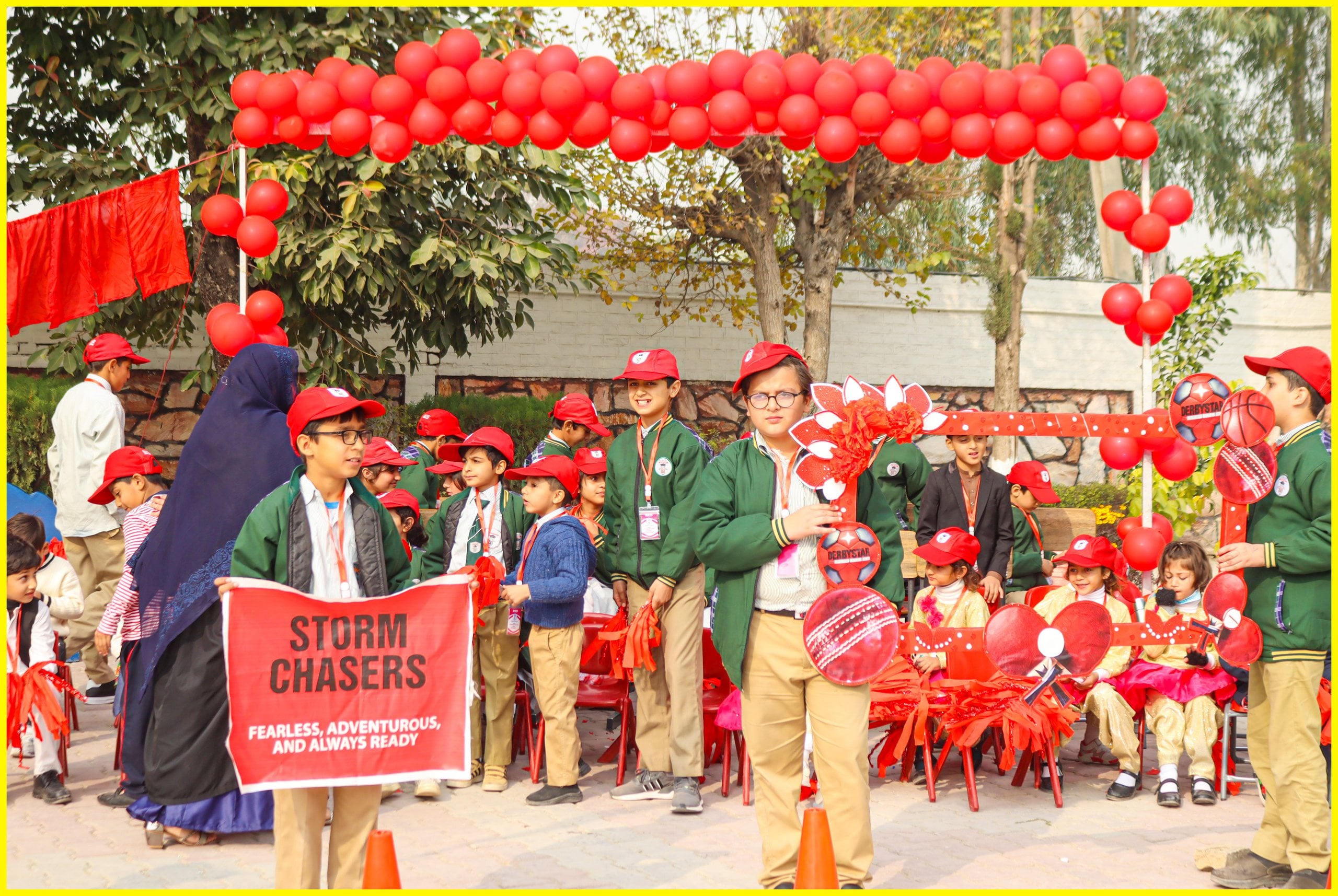 Middle school students with a house banner on sports day