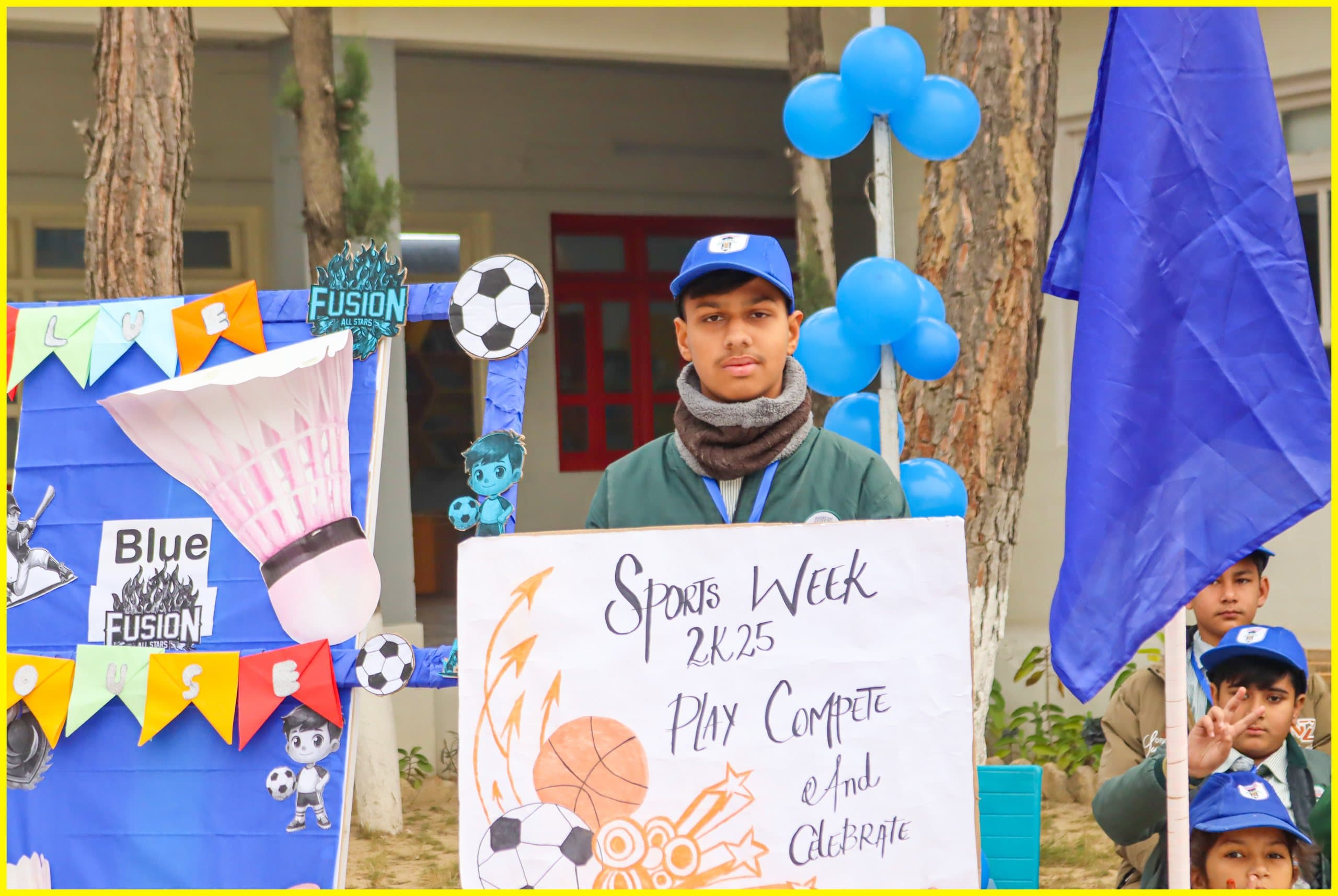 Student presenting a Sports Week display on campus