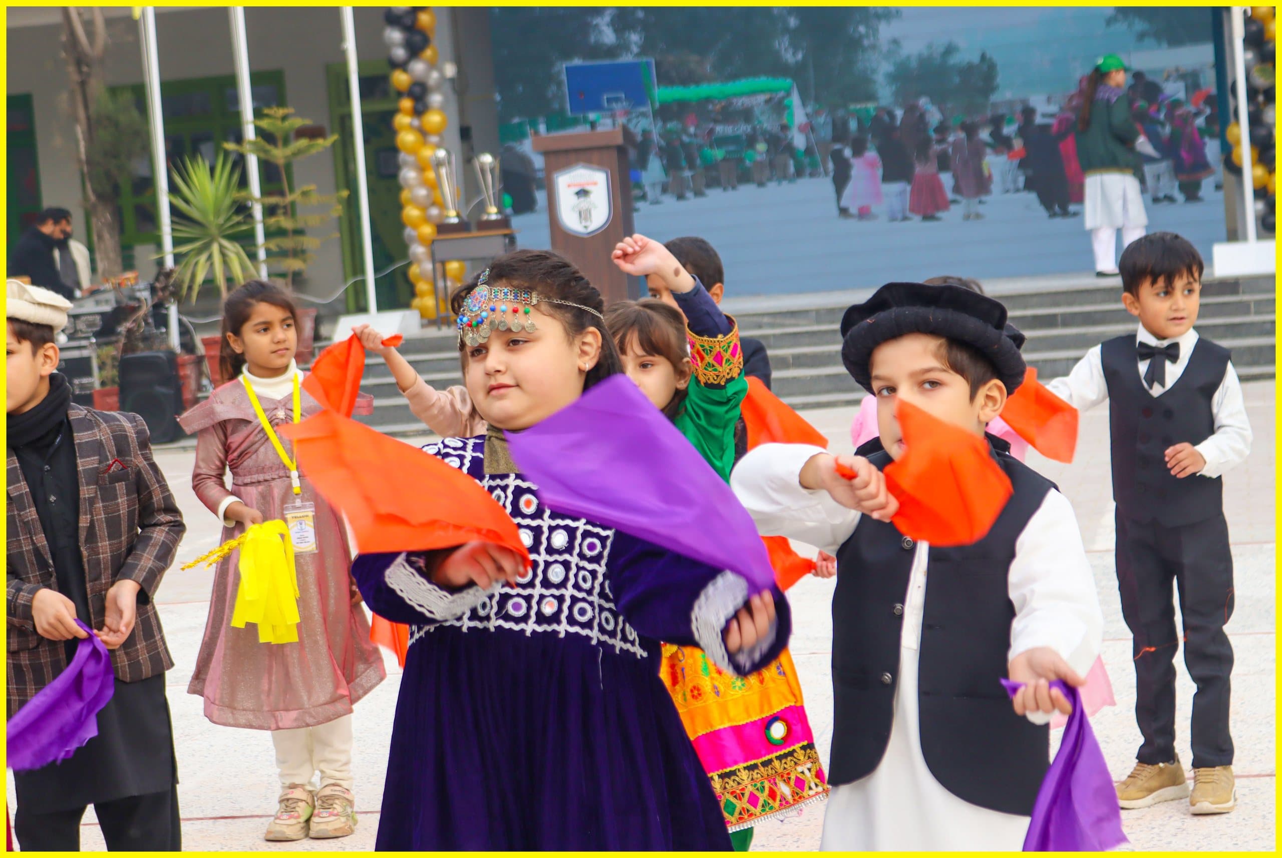 Students performing a cultural dance on the American Lycetuff Swabi campus